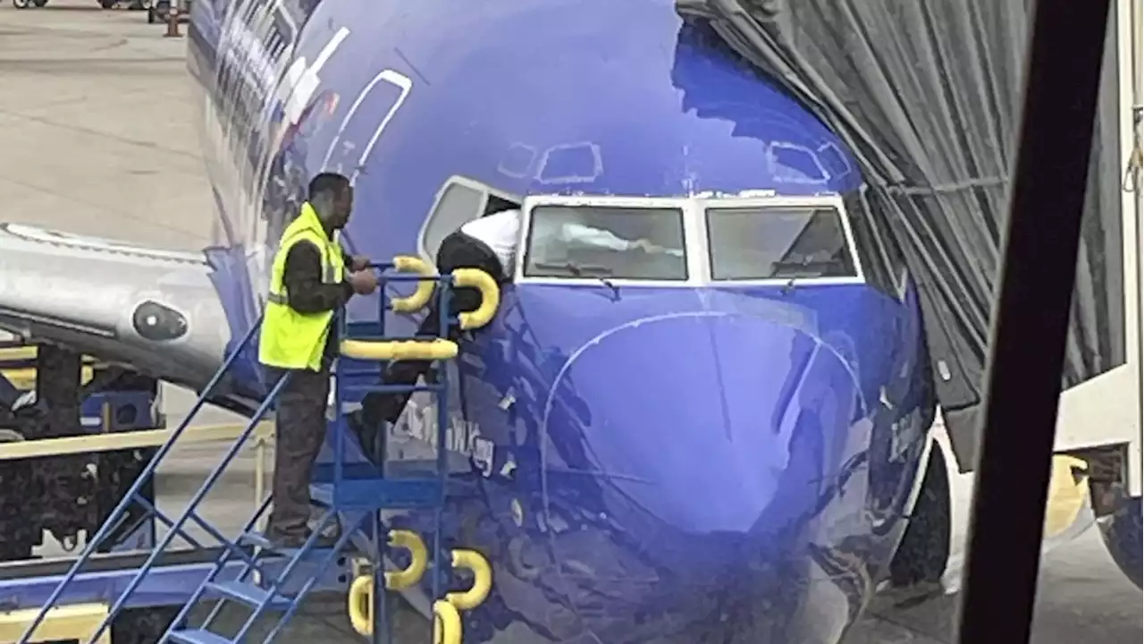 A Southwest pilot had to crawl into the cockpit window after the flight deck door was locked