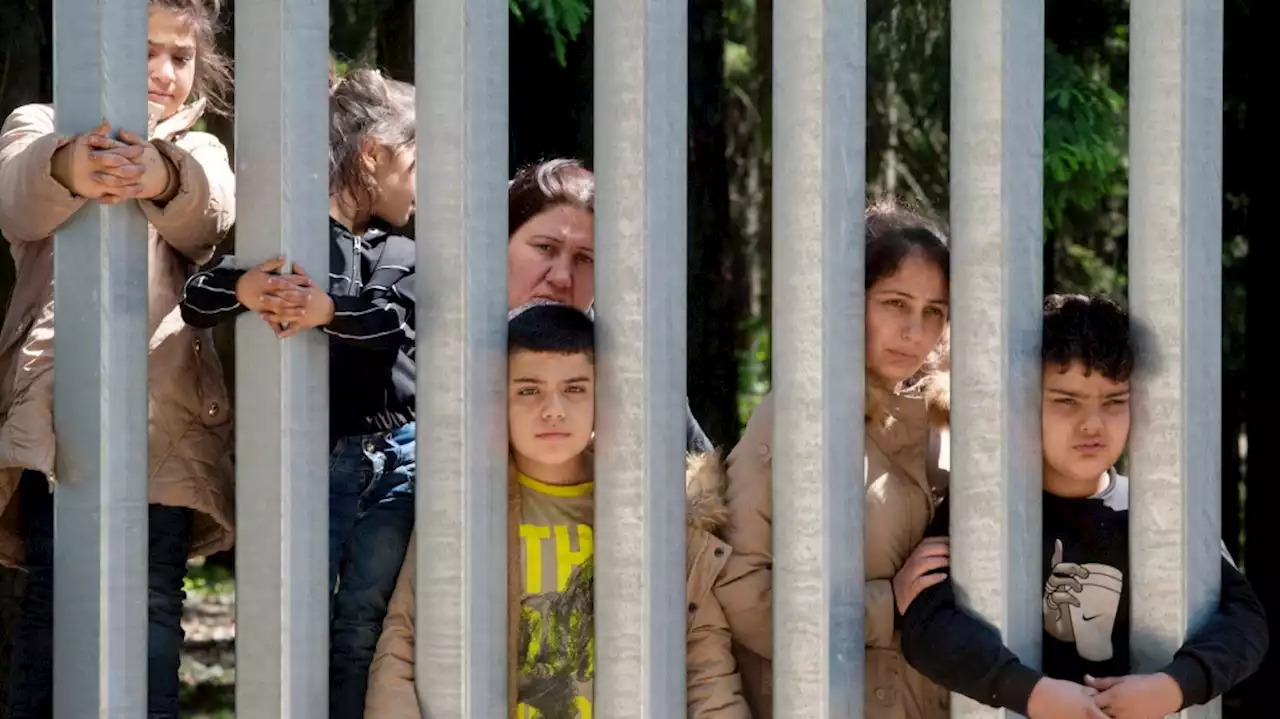 Migrants with children stuck at Poland's border wall; activists say Belarus won't let them turn back