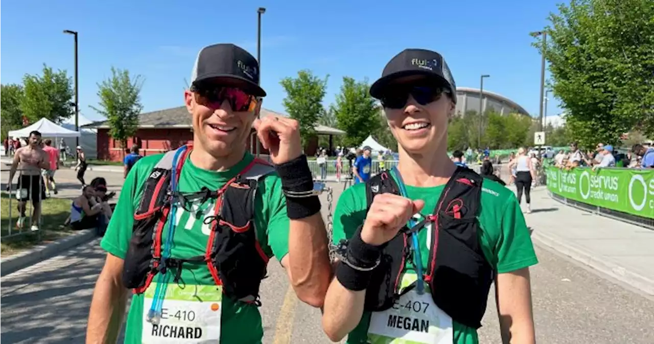 Calgary couple breaks world record by running a marathon handcuffed - Calgary | Globalnews.ca