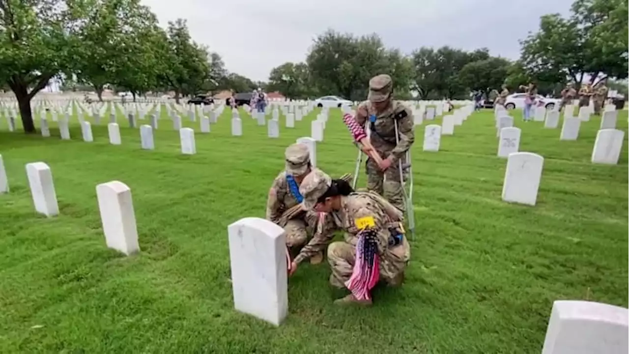 Flags placed on graves at Fort Sam Houston National Cemetery for Memorial Day