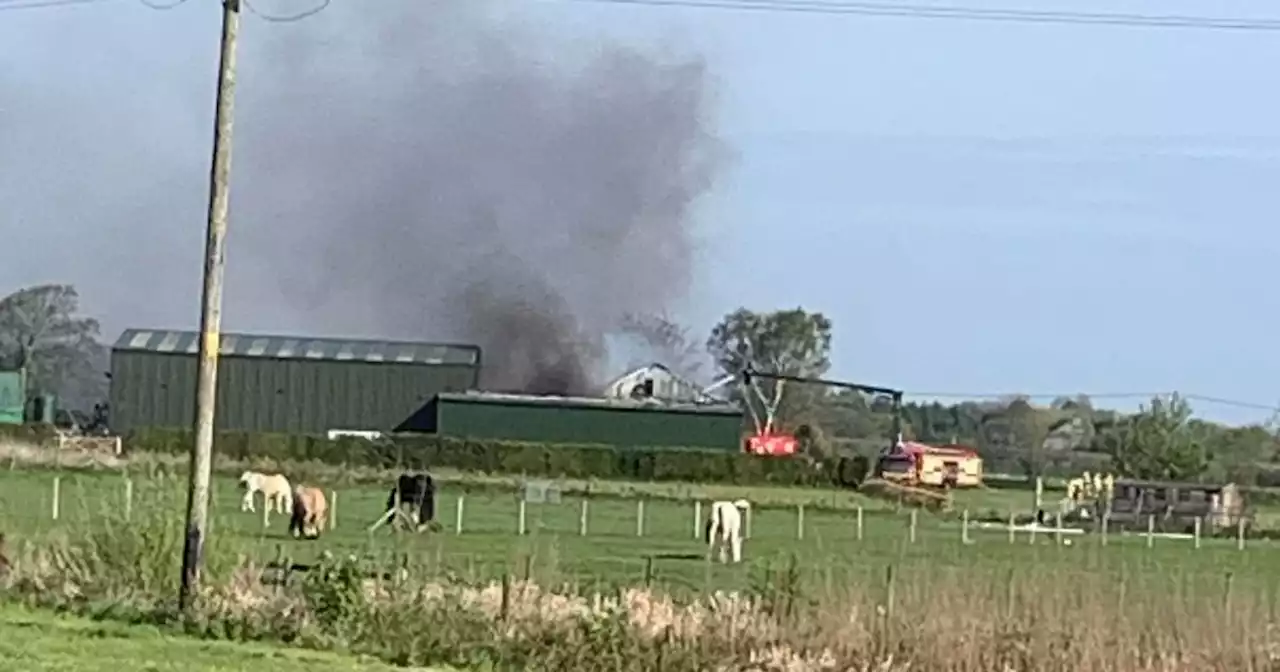 Fire engines rush to huge blaze as smoke seen billowing over countryside