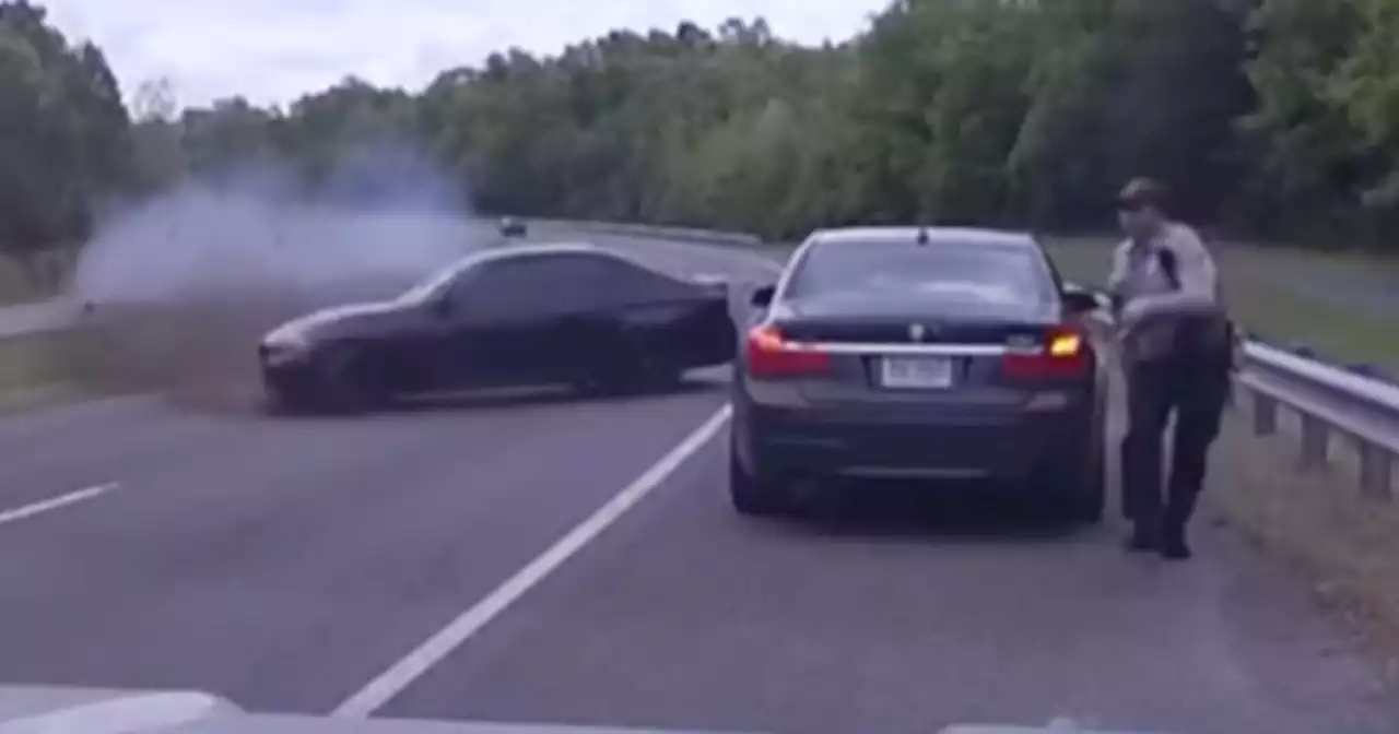 Officer on traffic stop barely avoids vehicle spinning out at 120 mph on Virginia highway