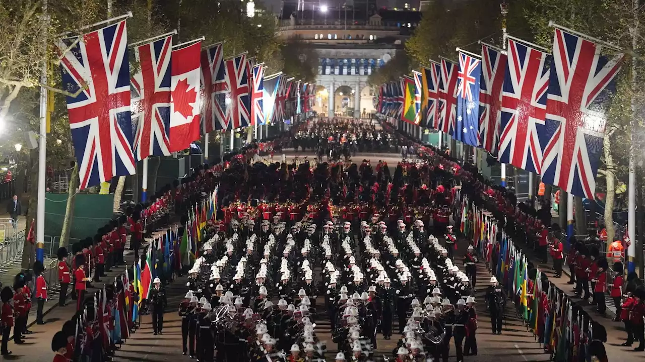 Early morning coronation rehearsals feature drumming soldiers and state coaches