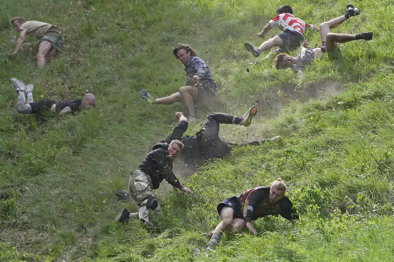 Racers chase cheese wheel down a hill in chaotic UK race