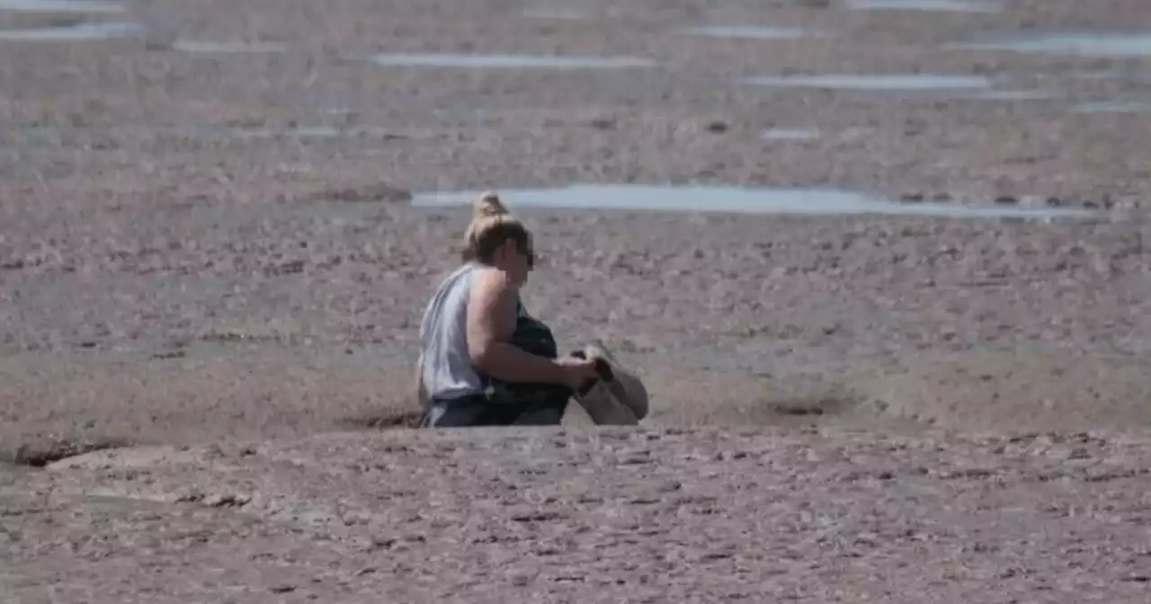 Warning issued after woman becomes stuck in mud at beauty spot