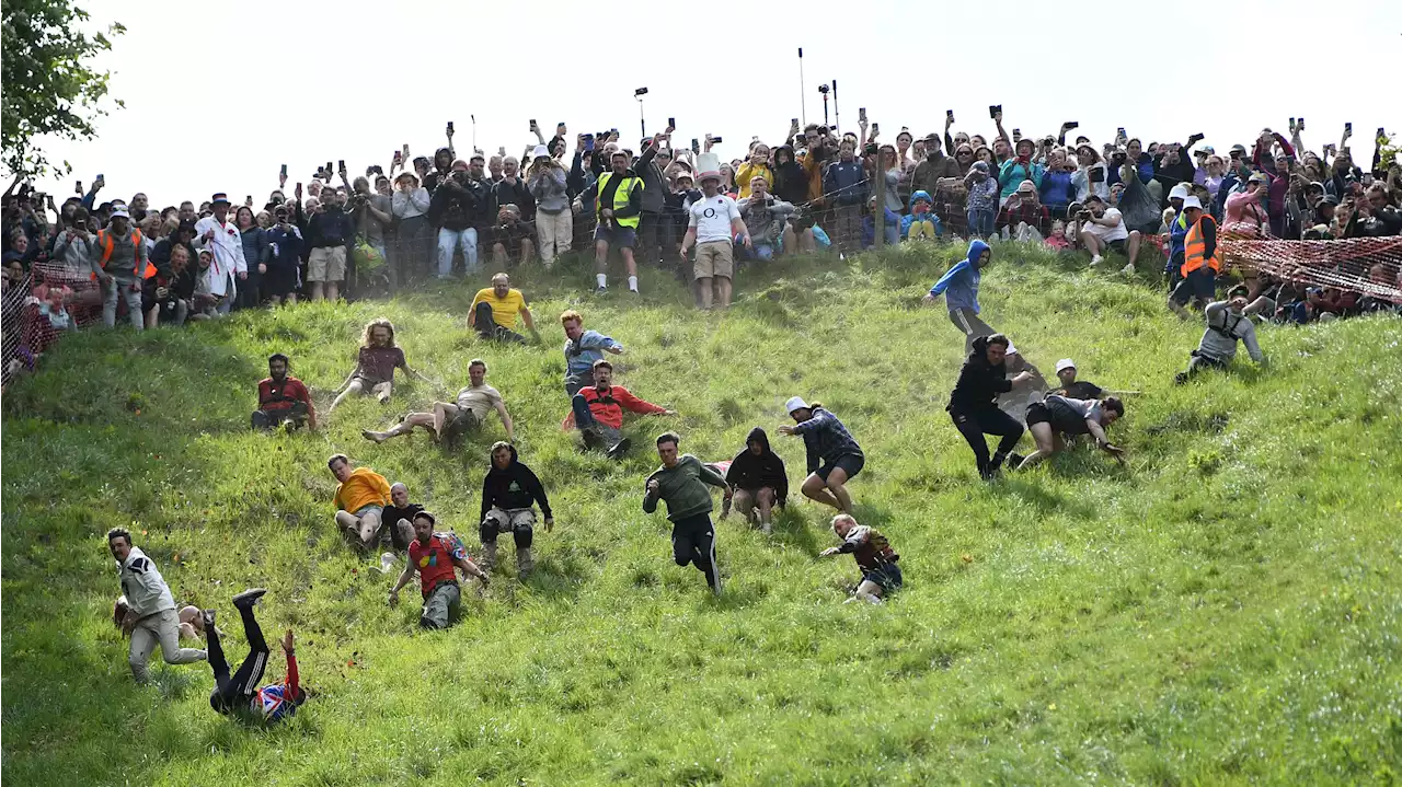 Contestants Chase Cheese Wheel Down a Hill in Chaotic UK Race