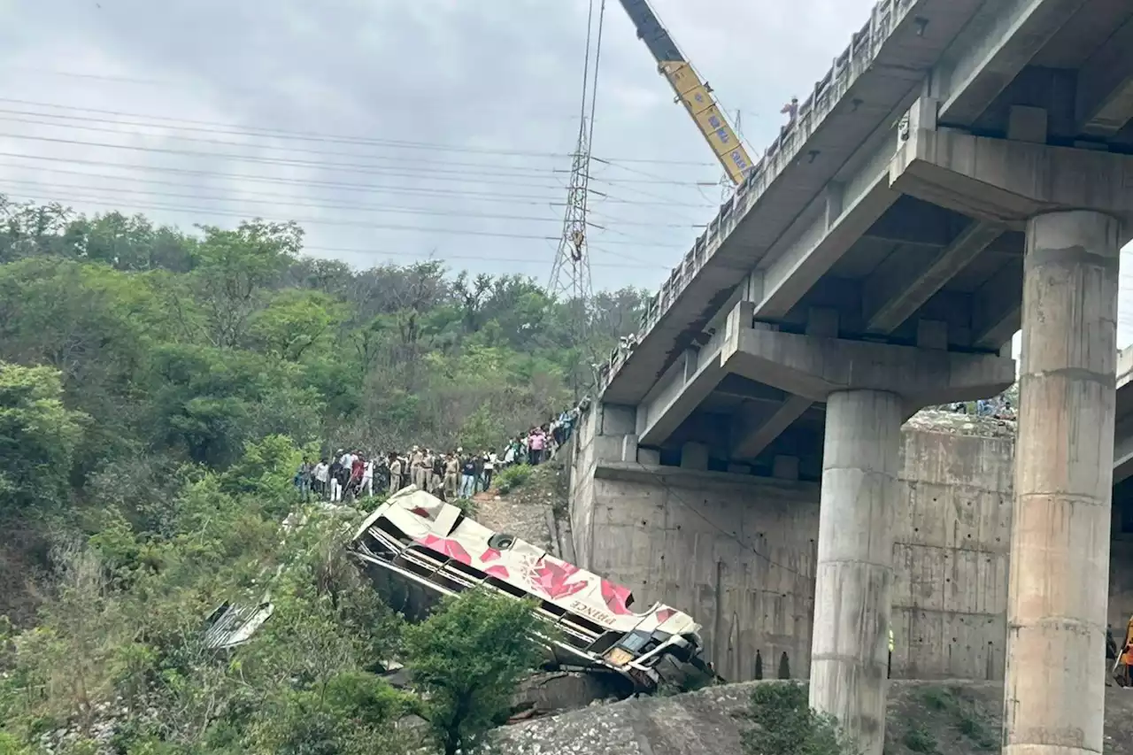 At least ten dead as packed bus plunges off motorway bridge