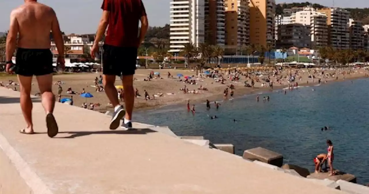 Surprised Spaniards face choice: Ballot box or the beach