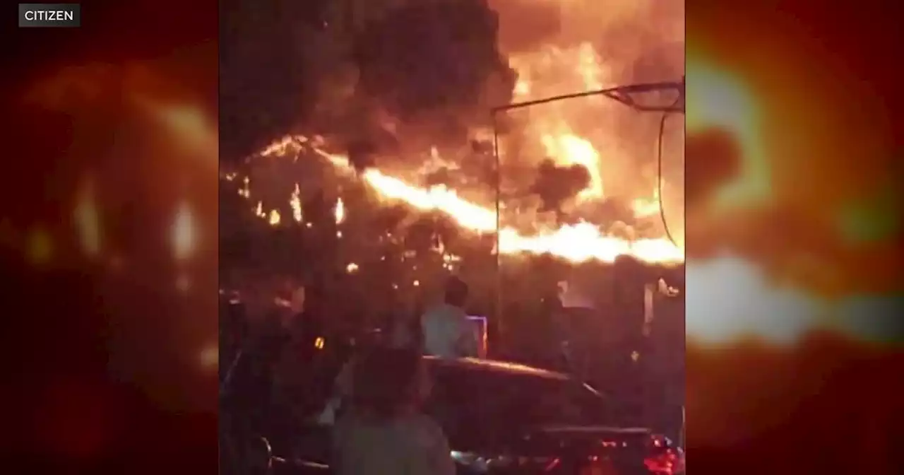 Massive fire burns overnight at tire shop in the Bronx