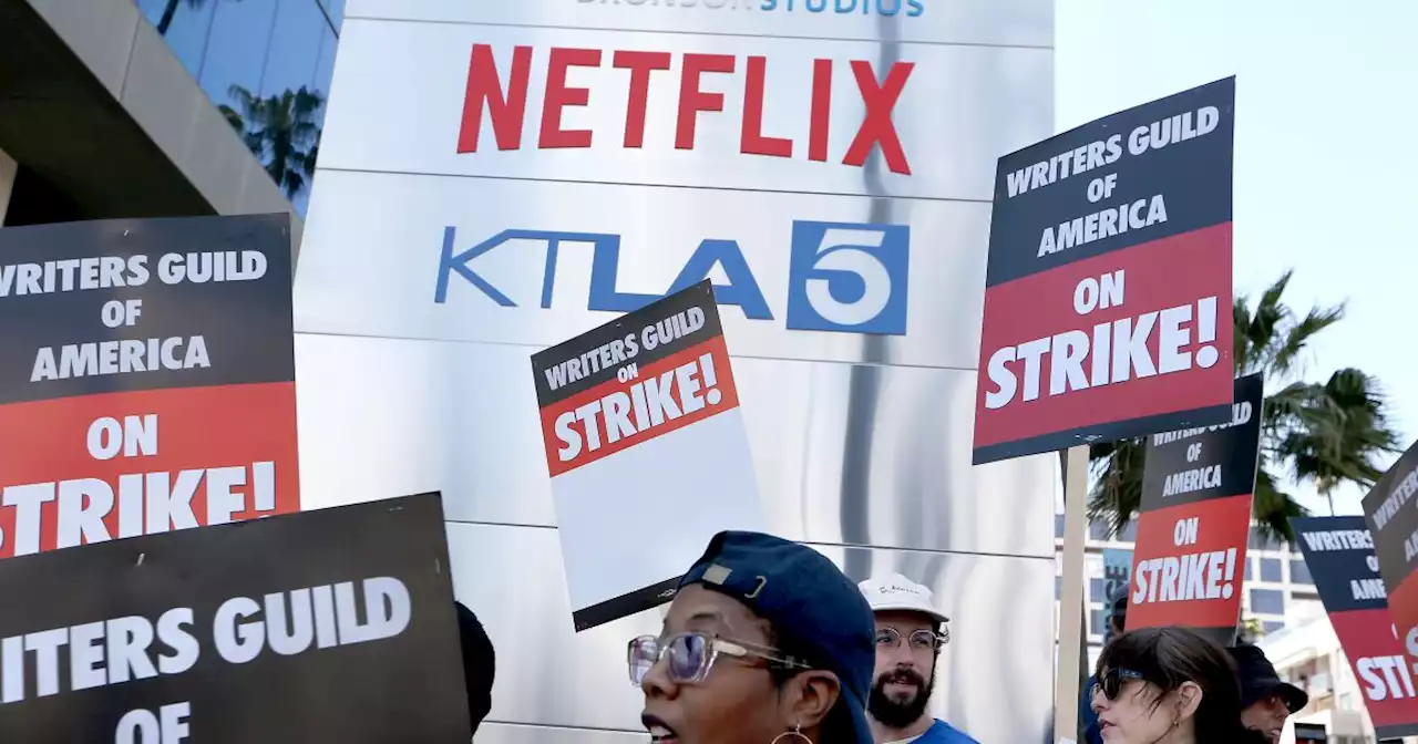 WGA blasts studio executive pay in message to Comcast, Netflix shareholders