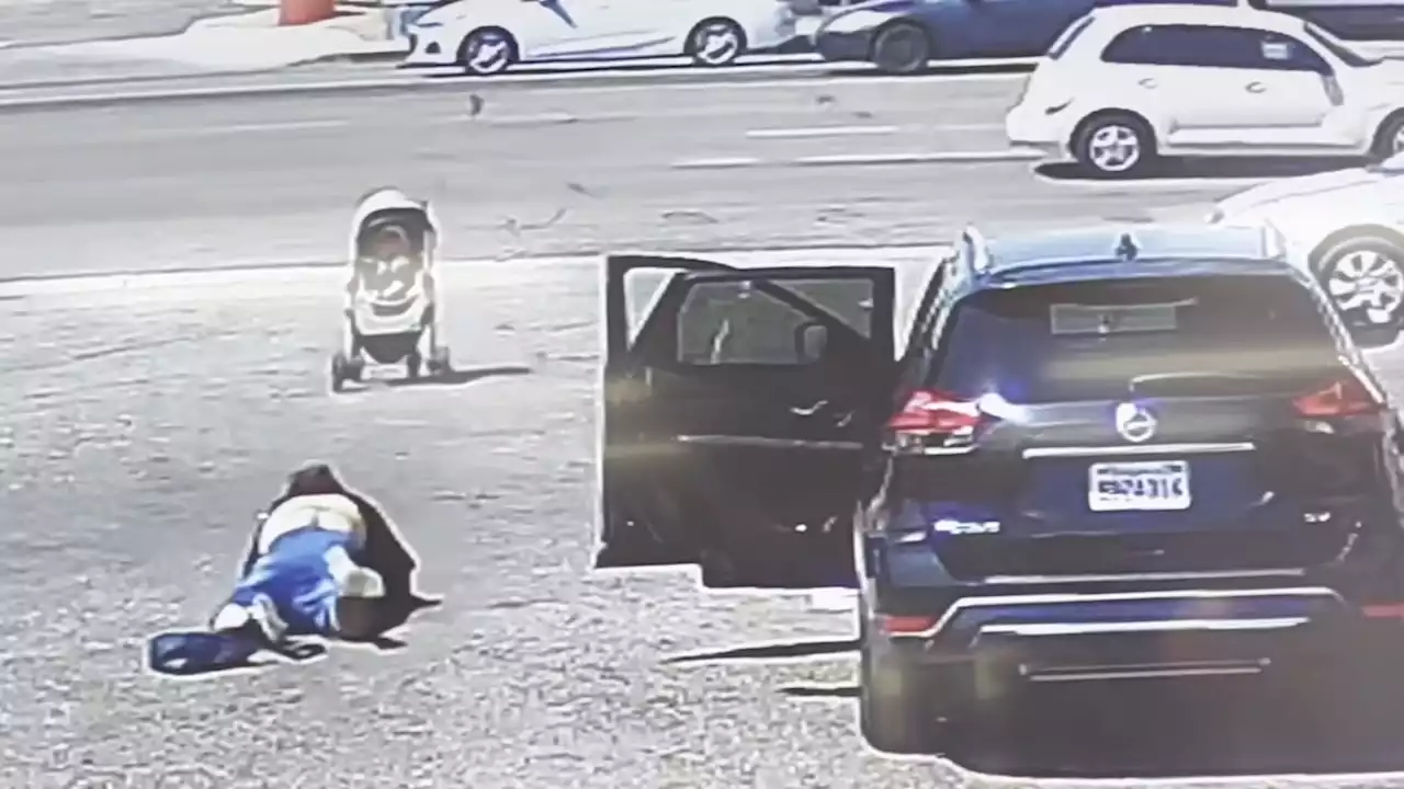 Video shows man rush to stop runaway stroller with baby right before it rolls into busy street