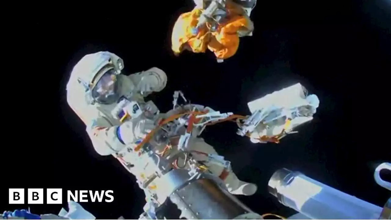 Space trash floats away during spacewalk