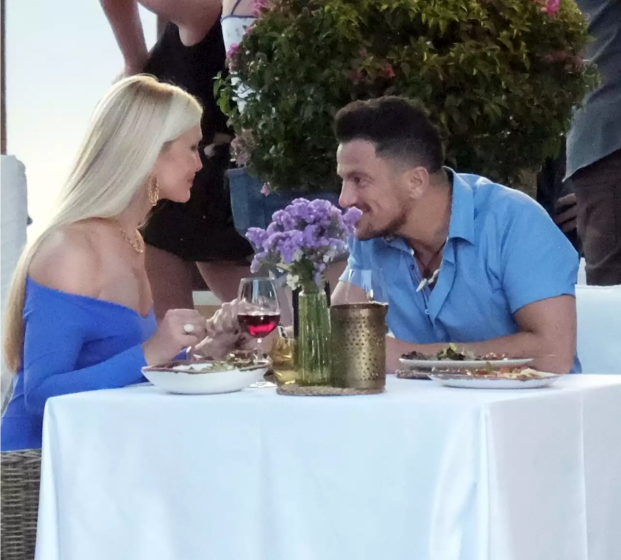 Peter Andre holds hands with Caprice as they enjoy lunch in Ibiza