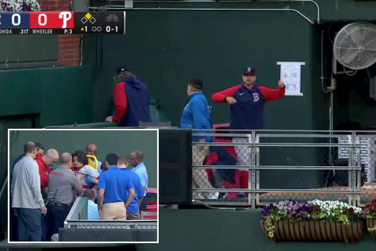 Fan stretchered off after falling into bullpen during Red Sox-Phillies game