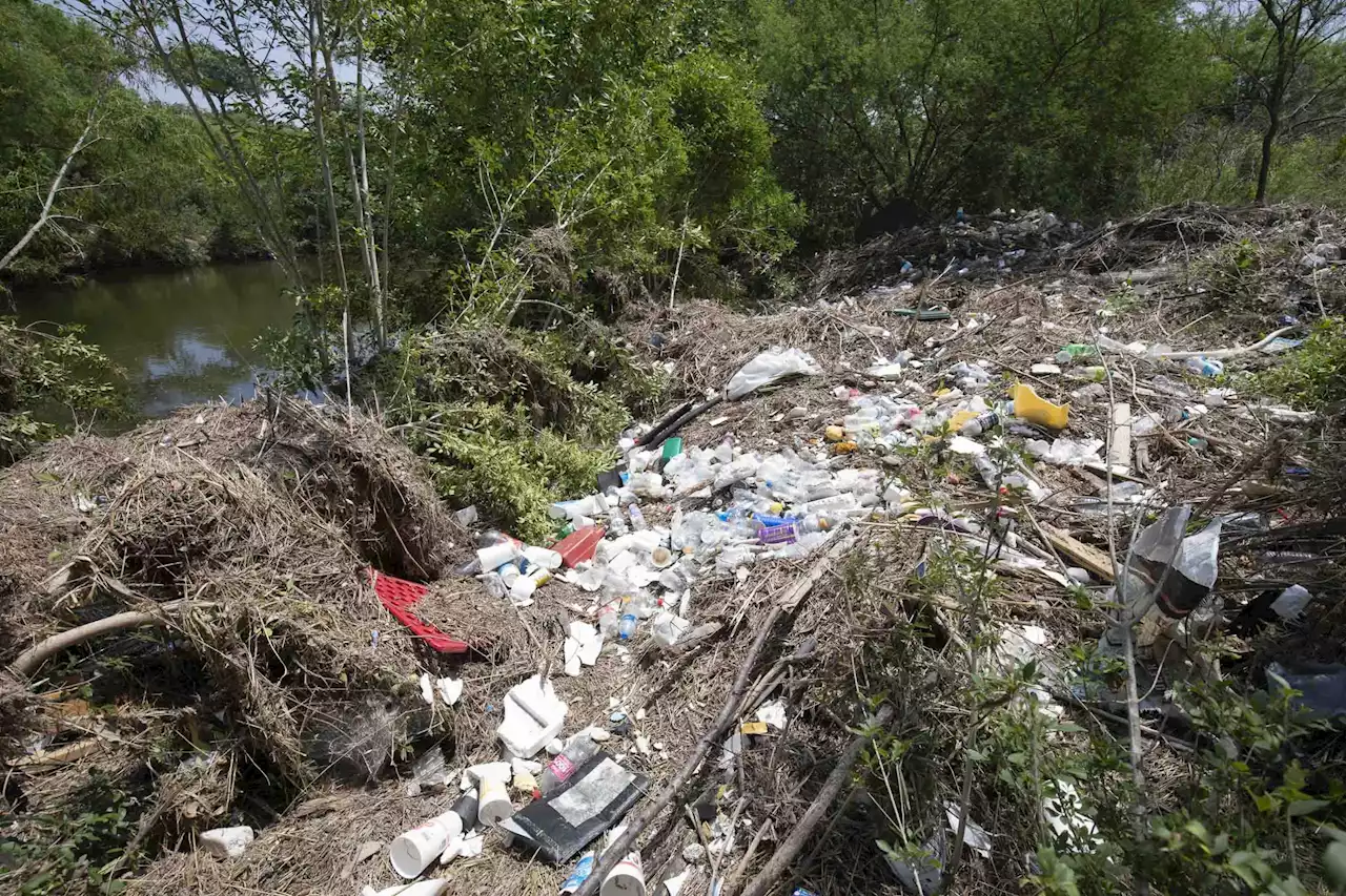 A river of litter: Mission Reach defaced by storms and Fiesta