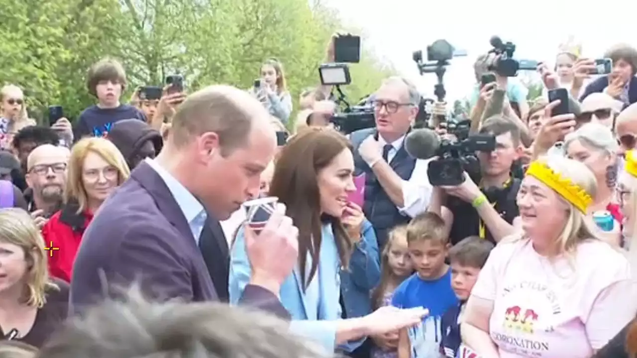 William gifted a drink as Prince and Princess of Wales meet royal fans in Windsor