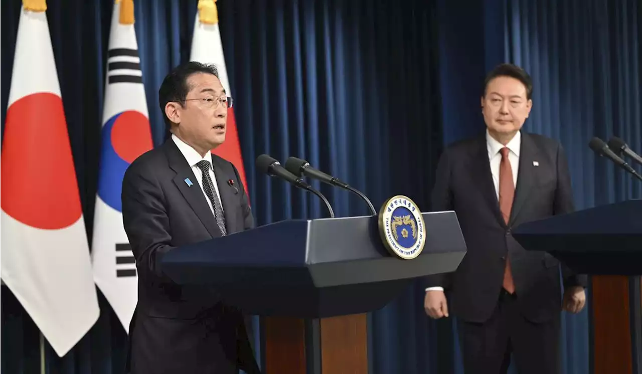 Japan PM Kishida comes bearing gifts in ice-breaking South Korea summit