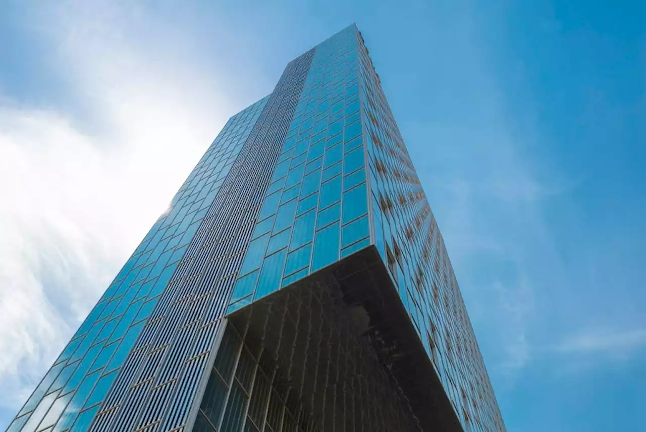 'French Spiderman' crawls up Barcelona skyscraper in climate action | Business