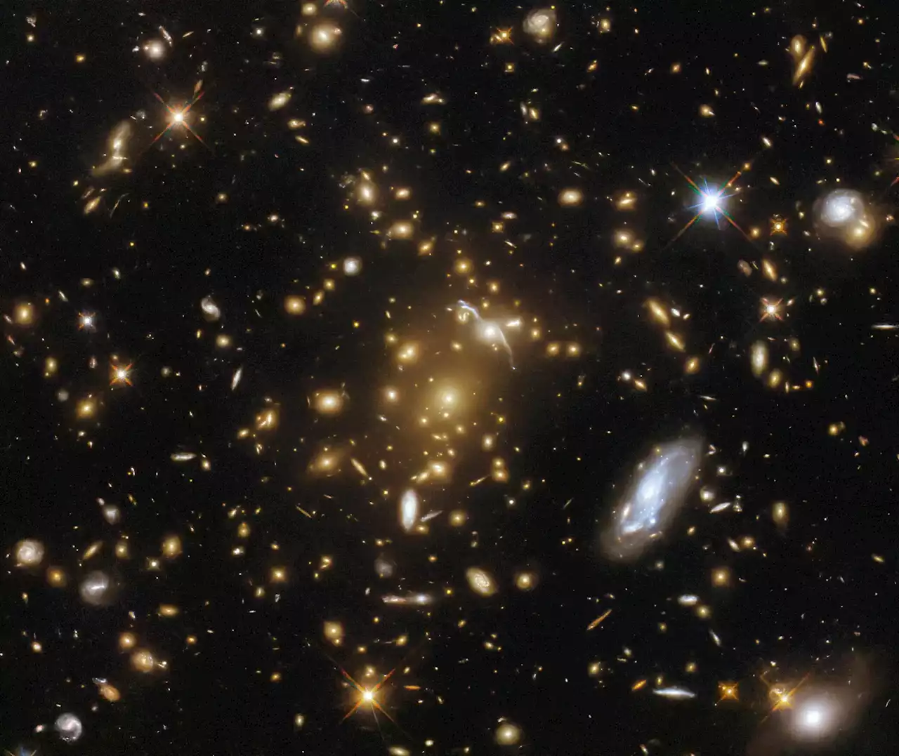 Cosmic Leviathan: Hubble Unveils an Exceptionally Massive Galaxy Cluster