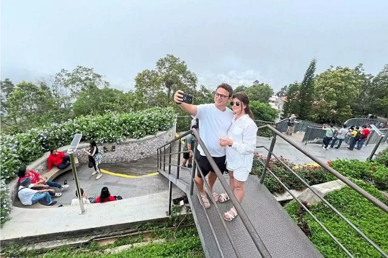 Tourists visit Penang Hill to escape city’s heat