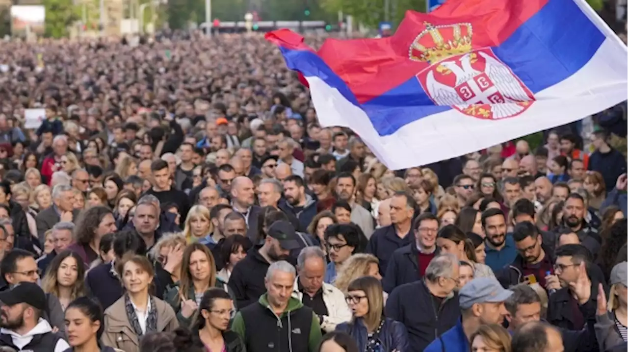 Thousands march in silence in Serbia after mass shootings