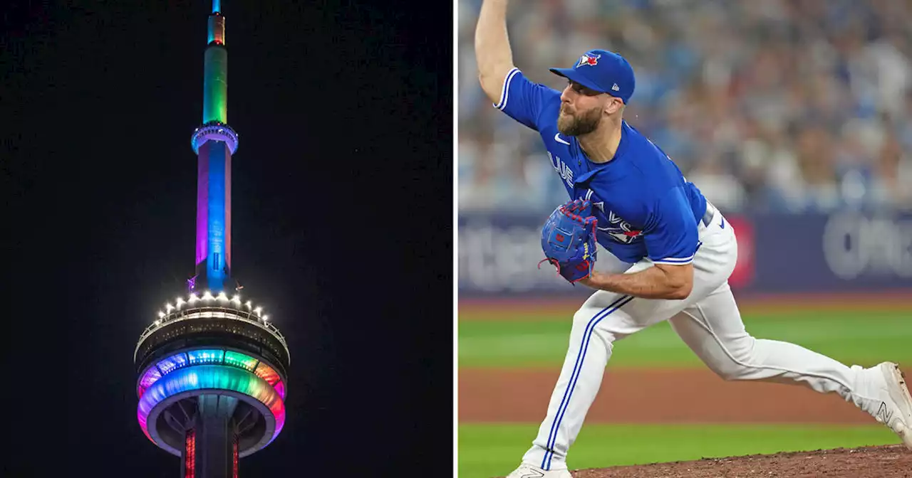 CN Tower lit up in Pride colours the moment Anthony Bass took the mound in Toronto