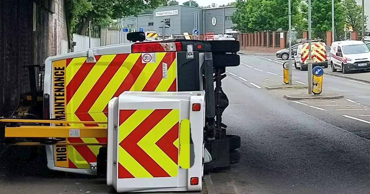 Van overturns in Paisley after driver fails to notice height restriction