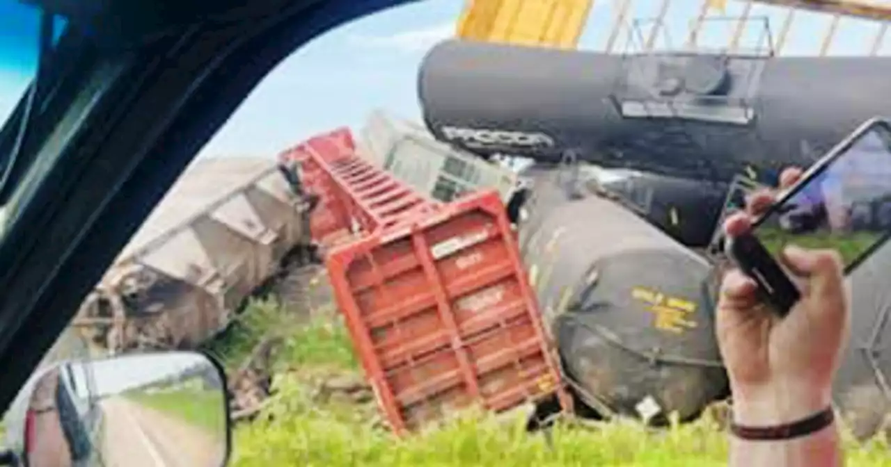 Train carrying hazardous materials derails and closes highway in Minnesota