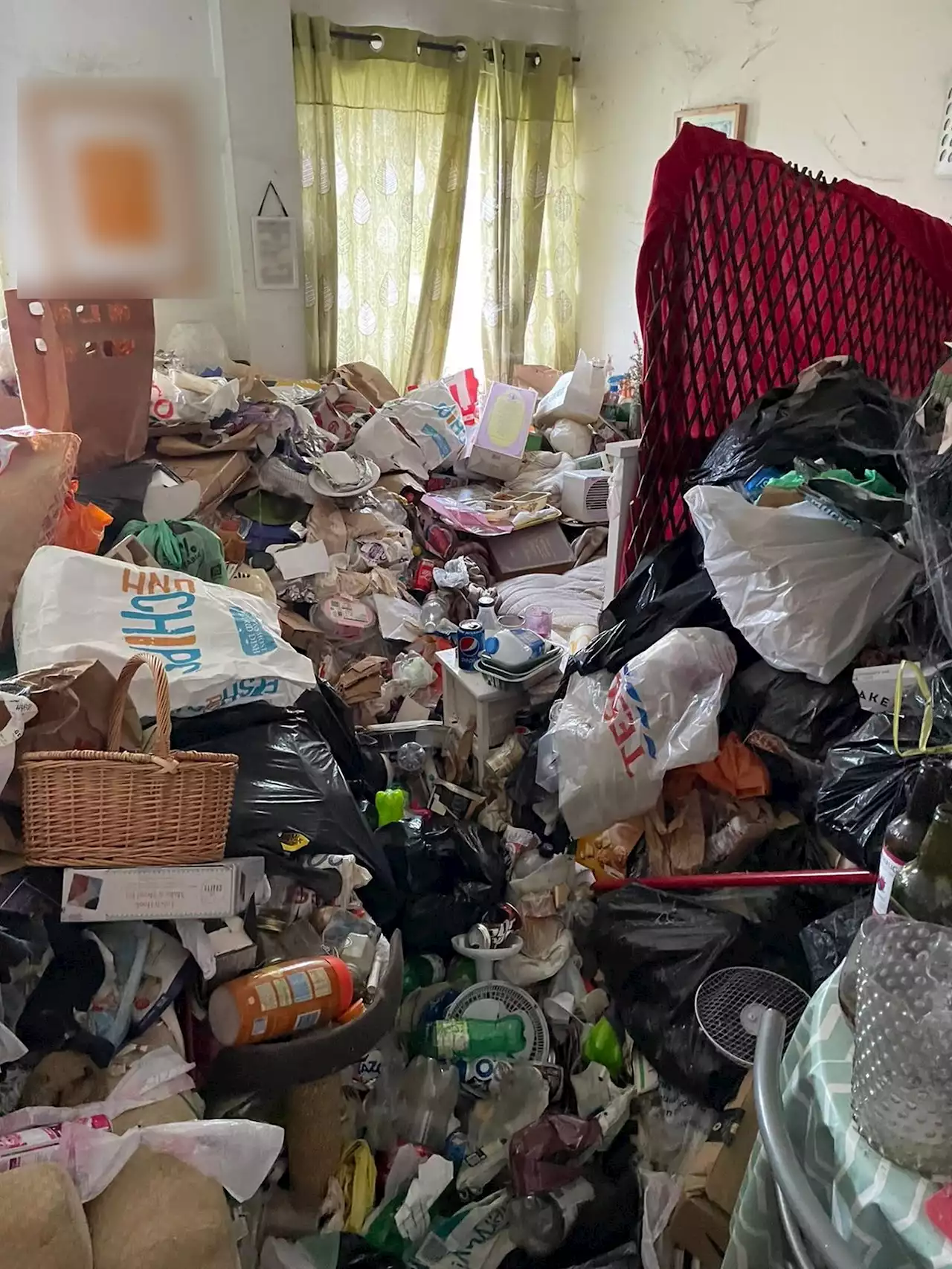 Inside Britain's 'FILTHIEST' home with floors covered in smelly rubbish