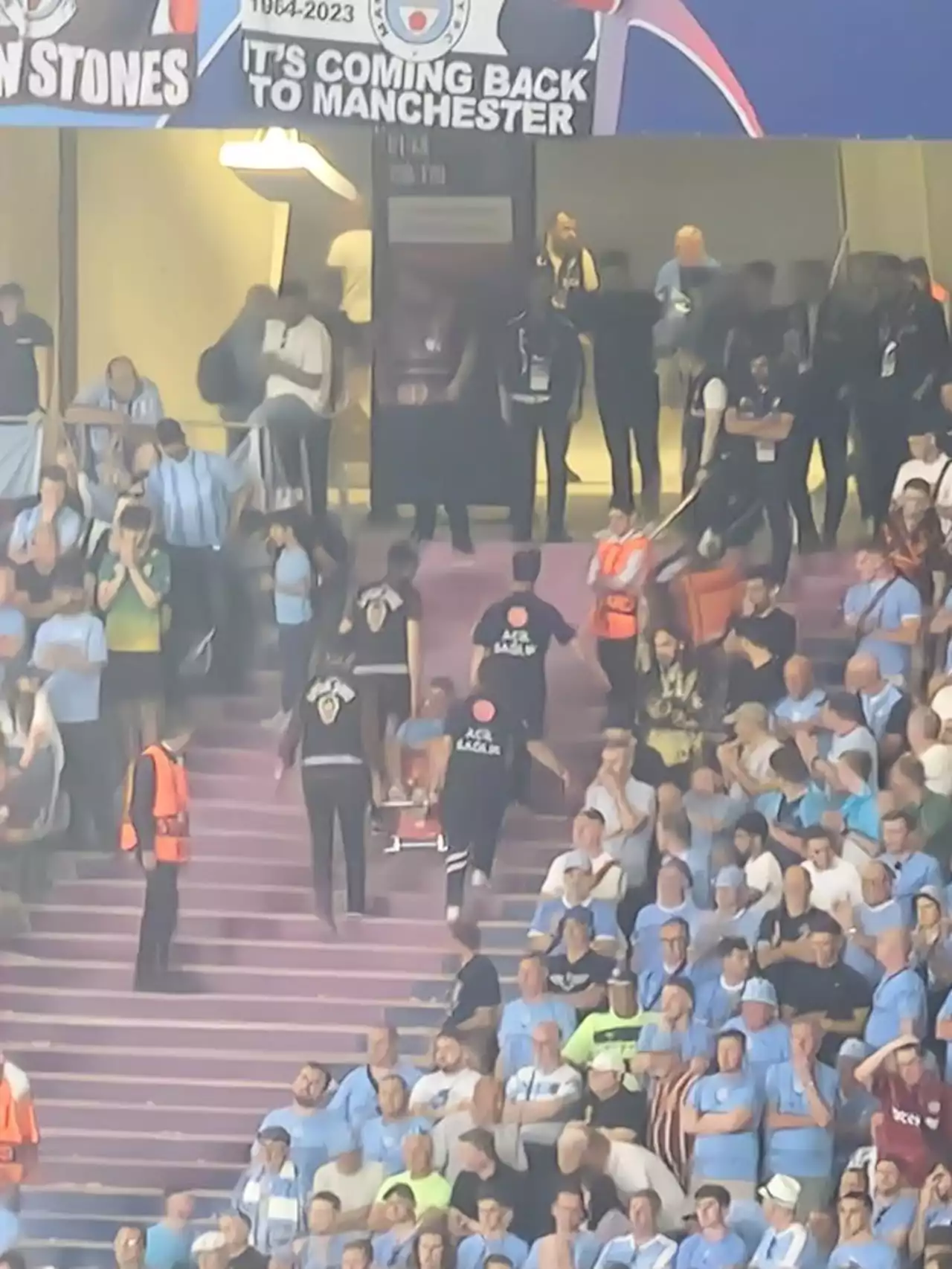 Worrying scenes as Man City fan stretchered stadium after appearing to collapse in stands