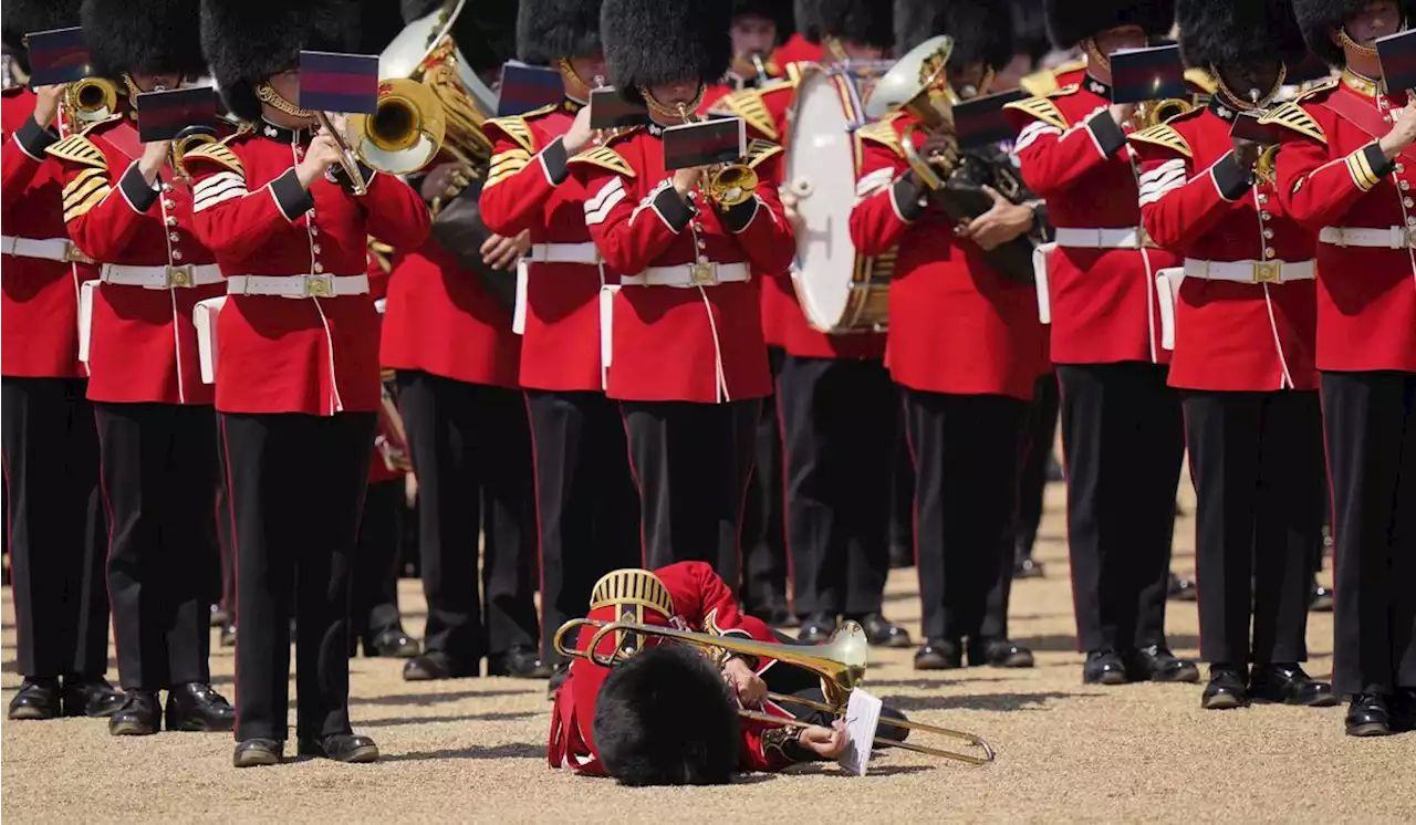 Troops feel the heat, and several faint, as Prince William reviews military parade