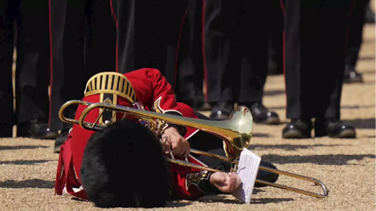 Troops feel the heat, and several faint, as Prince William reviews military parade