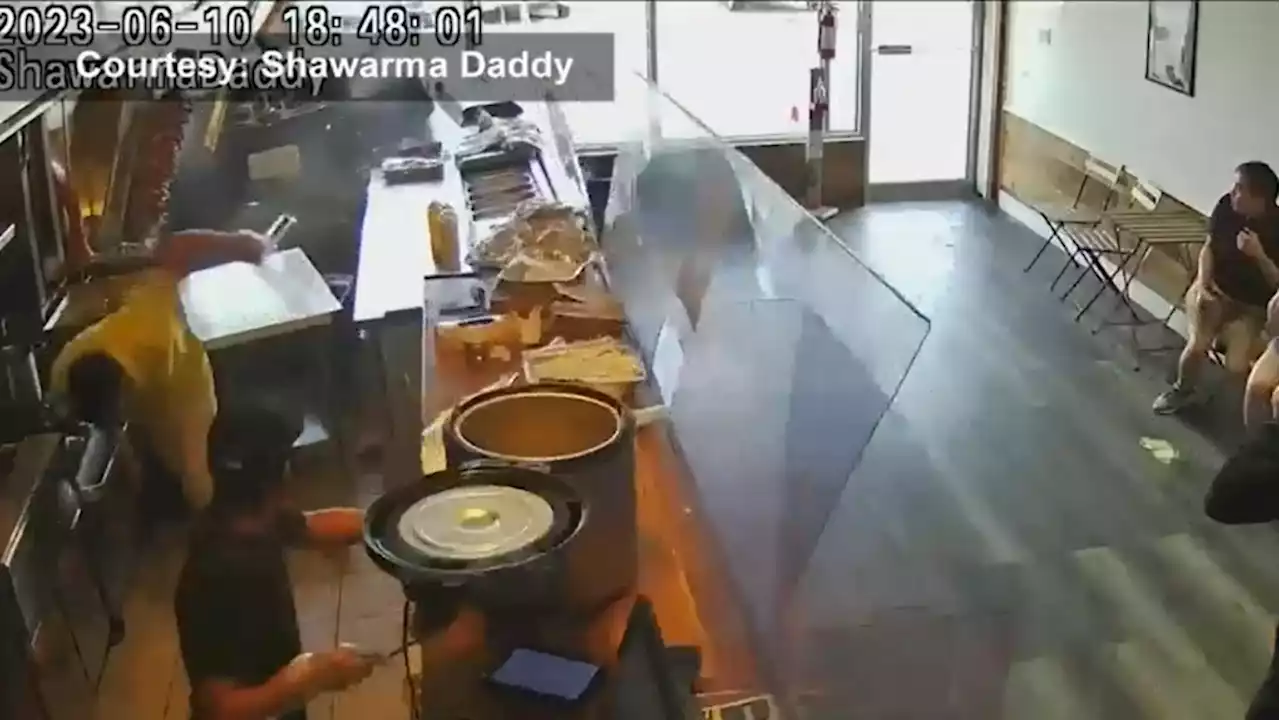 Moment SUV crashes through front window of Toronto restaurant caught on video