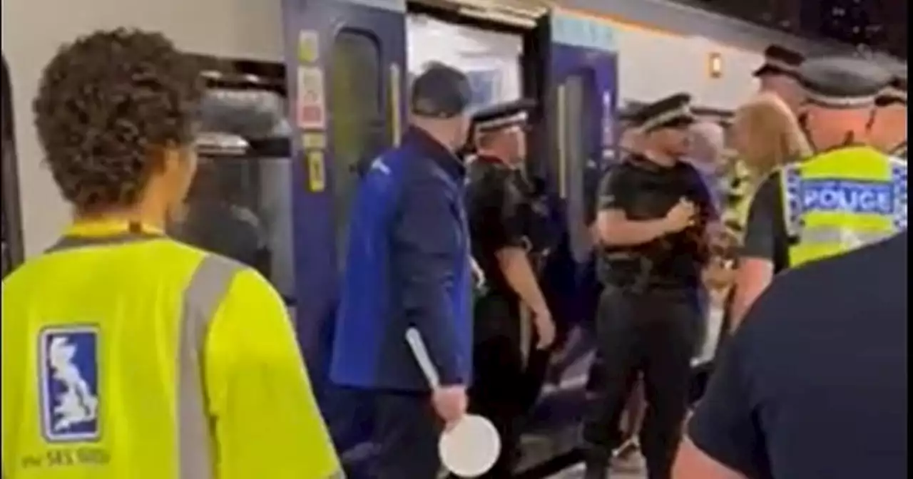 Fans try to squeeze into impossibly full last train from Manchester to Liverpool