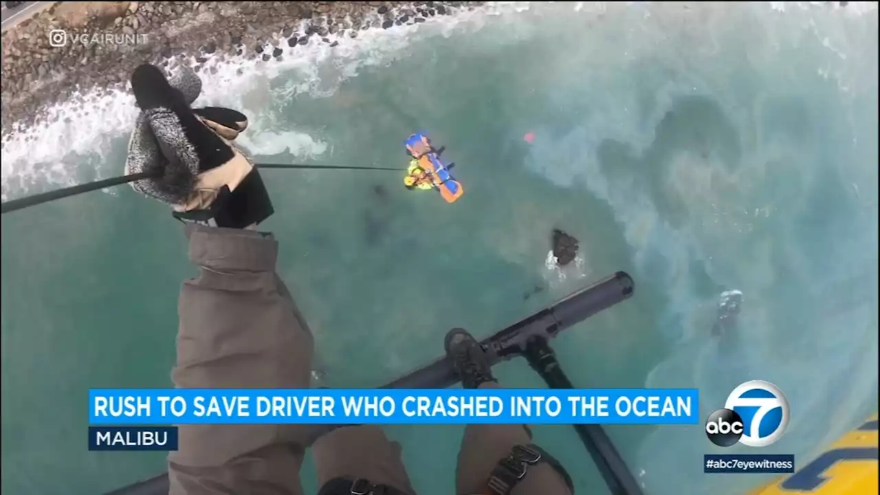 Video shows dramatic rescue of driver who drove off highway, crashed into ocean