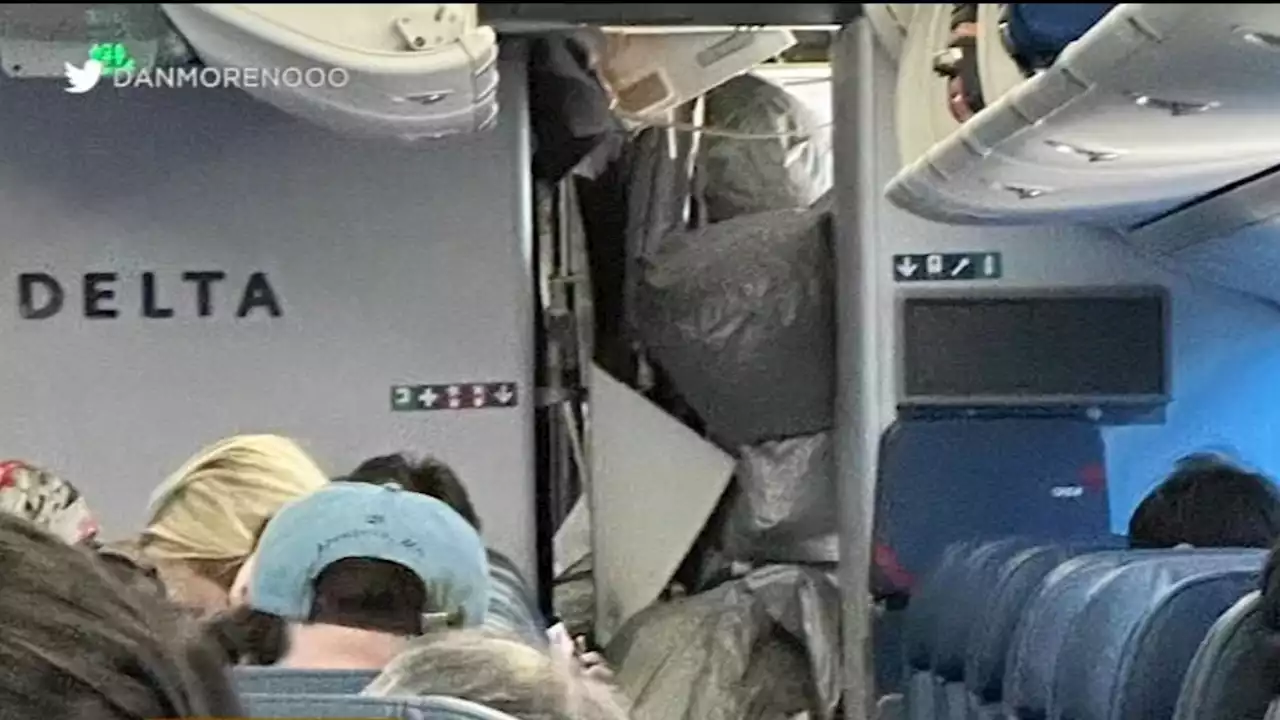 Crew member injured after emergency slide deploys inside Delta plane during flight