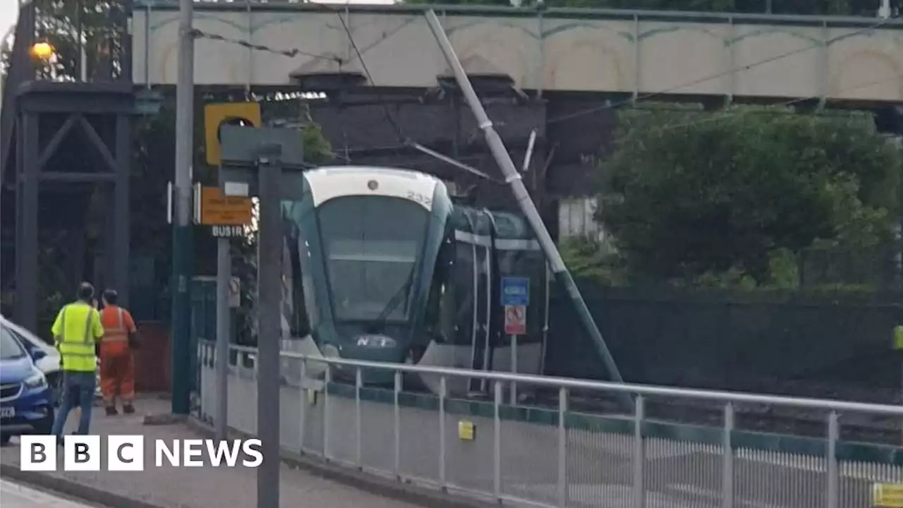 Nottingham passengers rescued after tram hits power wire pole