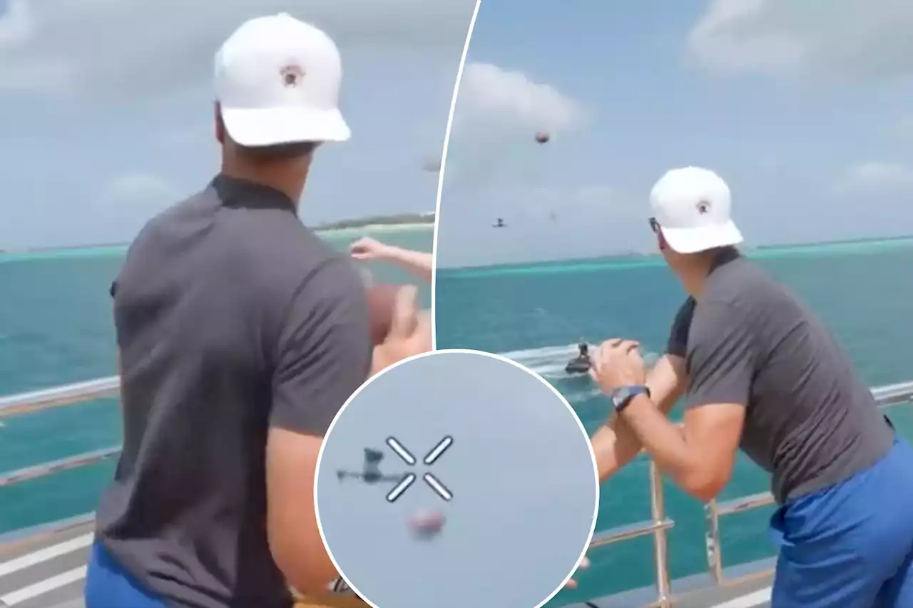 Tom Brady jokes of ending NFL retirement while nailing drone with football from yacht