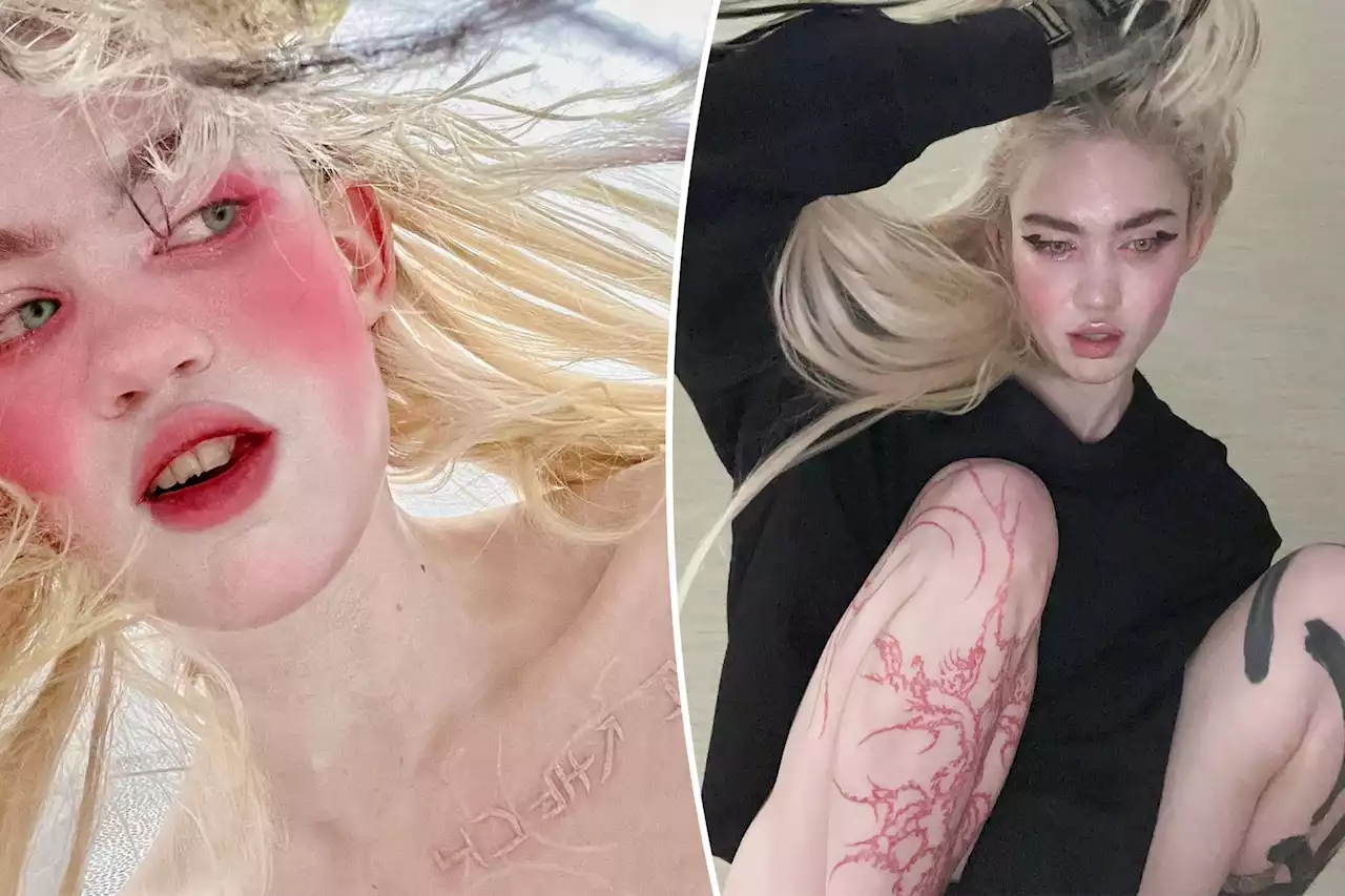 Grimes debuts fresh ‘alien scar’ chest tattoos: ‘I’m a little scared’