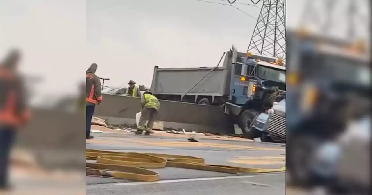 New video shows dump truck hanging over Gardiner median in brutal Toronto accident