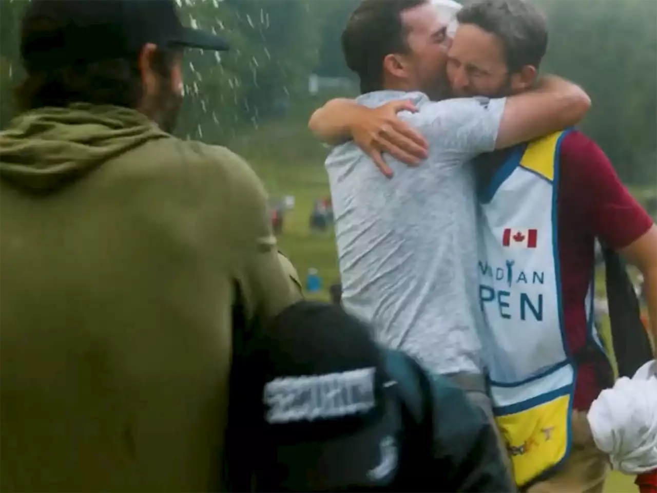 Childhood friend Adam Hadwin celebrating Nick Taylor's win tackled by security