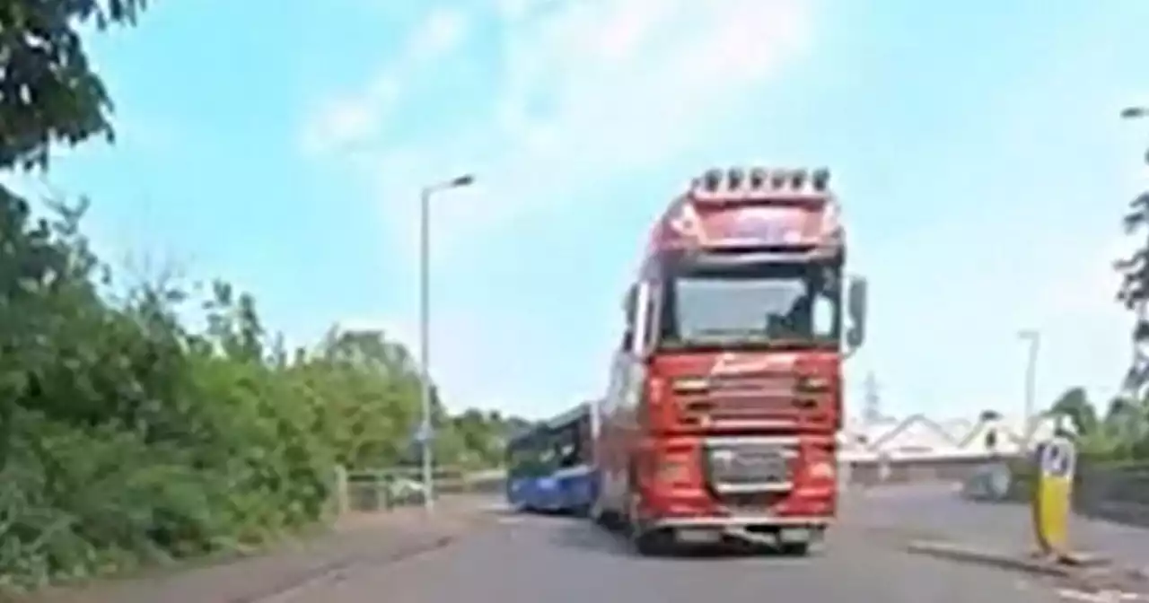 Lorry towing McGills bus filmed in 'near miss on wrong side of roundabout'