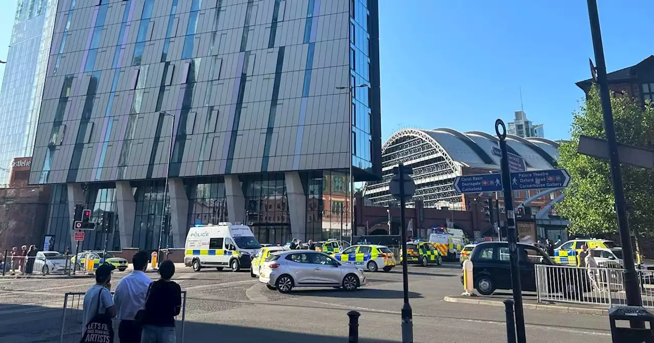 Huge police presence outside high rise block in Manchester city centre - live