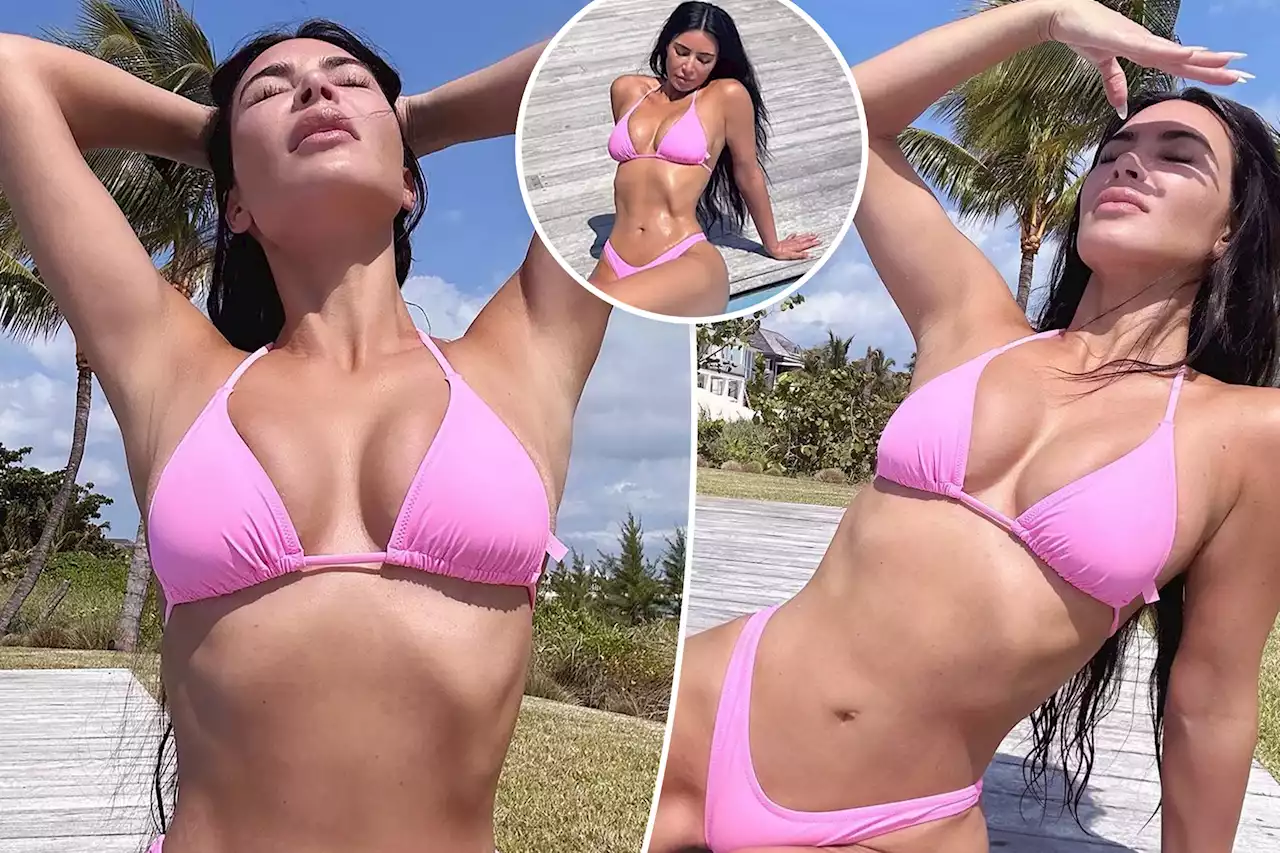 Kim Kardashian strikes sexy poses poolside in teeny pink bikini: ‘Pinky swear’