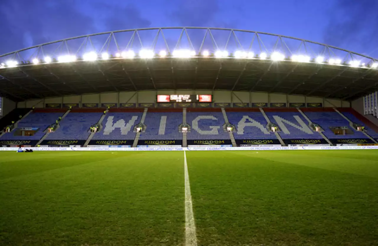 Local businessman buys Wigan and pays off outstanding debts