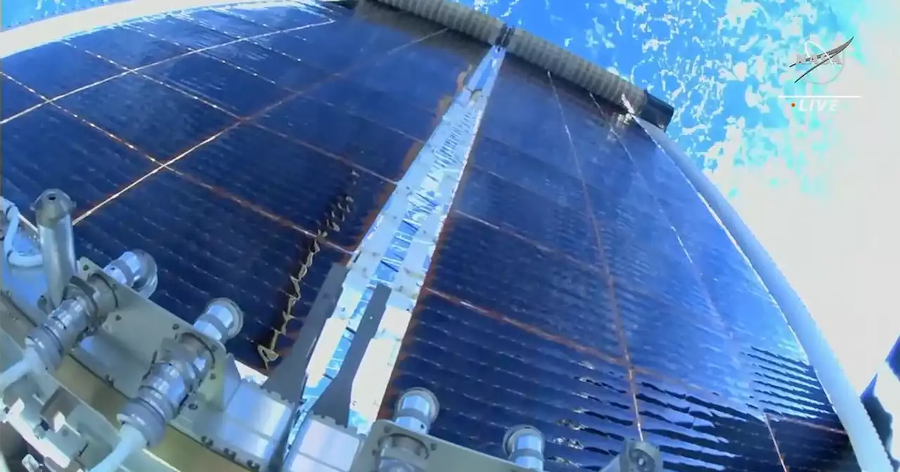 Spacewalkers install sixth supplemental solar array in space station power upgrade