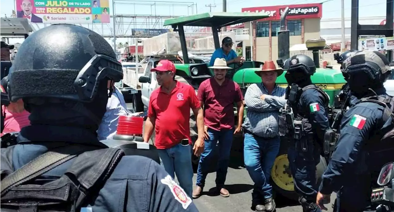 Rubén Rocha y productores de maíz acuerdan desalojo de aeropuerto de Culiacán