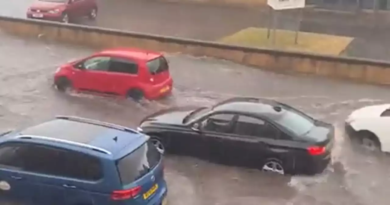 Flooding wreaks havoc across Glasgow with cars stuck and roads submerged