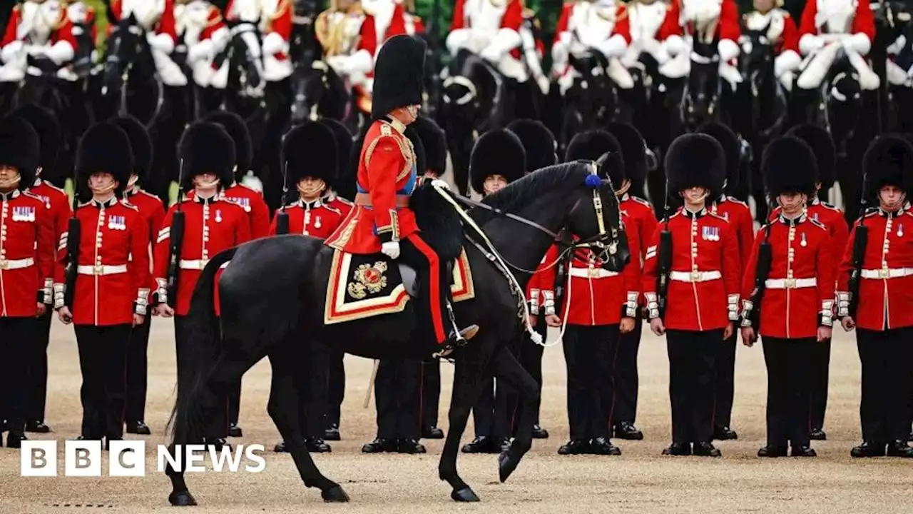 King rides on horseback in first Trooping the Colour as monarch