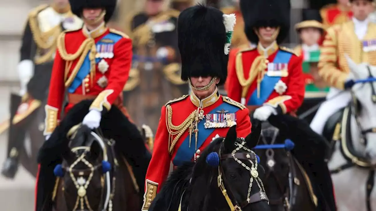 King Charles III rides on horseback in first official birthday parade | CNN